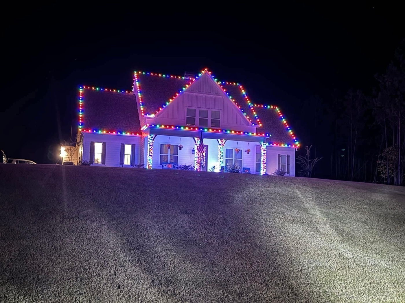 Multicolor Christmas lights on white home